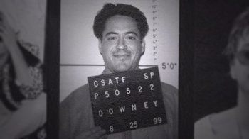 A black and white photo of robert downey , jr