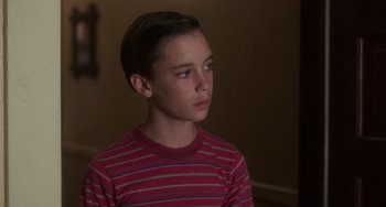 Movie still from “Stand by Me” (1986), directed by Rob Reiner – A boy in a red striped shirt looking to his left; Close Up shot, Low angle