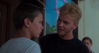 Movie still from “Stand by Me” (1986), directed by Rob Reiner – Two young men talking to each other on a bus; Close Up shot, Over the shoulder angle