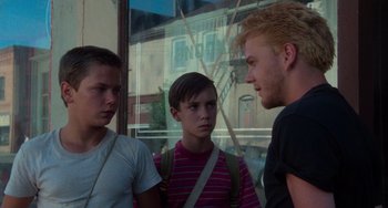 Movie still from “Stand by Me” (1986), directed by Rob Reiner – A group of young men standing next to each other; Medium shot, Over the shoulder angle
