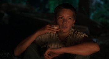 Movie still from “Stand by Me” (1986), directed by Rob Reiner – A young man smoking a cigarette while sitting on a couch; Close Up shot, High angle