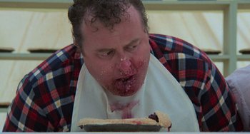 Movie still from “Stand by Me” (1986), directed by Rob Reiner – A man is eating a piece of pie; Close Up shot, Over the shoulder angle