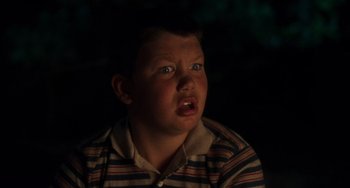 Movie still from “Stand by Me” (1986), directed by Rob Reiner – A young boy with blue eyes is looking up; Close Up shot, Low angle