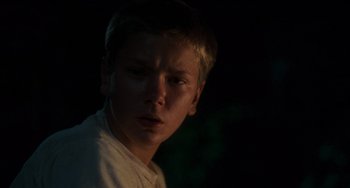 Movie still from “Stand by Me” (1986), directed by Rob Reiner – A young man is looking into the camera; Close Up shot, Over the shoulder angle