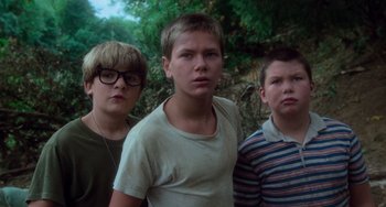 Movie still from “Stand by Me” (1986), directed by Rob Reiner – A group of young men standing next to each other; Close Up shot, Low angle