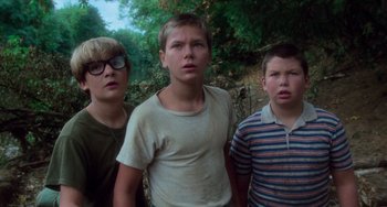 Movie still from “Stand by Me” (1986), directed by Rob Reiner – A group of young men standing next to each other; Medium shot, Low angle