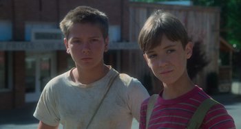 Movie still from “Stand by Me” (1986), directed by Rob Reiner – Two young boys standing next to each other; Close Up shot, Low angle
