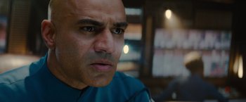 Movie still from “Star Trek” (2009), directed by J.J. Abrams – A man's face in a room; Close Up shot, Over the shoulder angle
