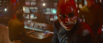 Movie still from “Star Trek” (2009), directed by J.J. Abrams – A man with a bald head is looking at the camera; Close Up shot, Over the shoulder angle