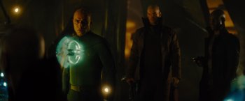 Movie still from “Star Trek” (2009), directed by J.J. Abrams – A man in a green suit holding a flashlight and another man in a black jacket holding a gun; Medium shot, Over the shoulder angle