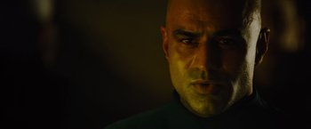 Movie still from “Star Trek” (2009), directed by J.J. Abrams – A man with a bald head is looking at the camera; Close Up shot, Low angle
