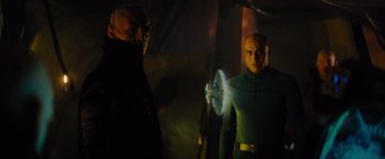 Movie still from “Star Trek” (2009), directed by J.J. Abrams – Two people in a dark room with a light shining on them; Medium shot, Over the shoulder angle