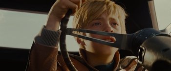 Movie still from “Star Trek” (2009), directed by J.J. Abrams – A young boy holding a pair of scissors in his hands; Close Up shot, High angle