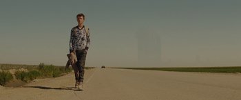 Movie still from “Star Trek” (2009), directed by J.J. Abrams – A young man riding a skateboard down the side of a road; Wide shot, Low angle