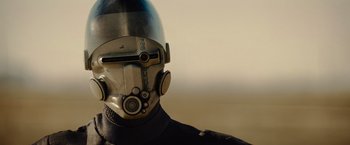 Movie still from “Star Trek” (2009), directed by J.J. Abrams – A person's face with a helmet on; Close Up shot, Over the shoulder angle