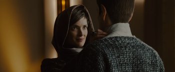 Movie still from “Star Trek” (2009), directed by J.J. Abrams – A woman wearing a head scarf is looking at a man; Close Up shot, Over the shoulder angle