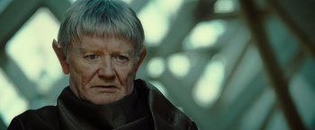 Movie still from “Star Trek” (2009), directed by J.J. Abrams – An old man with a gray hair and a black shirt; Close Up shot, Over the shoulder angle