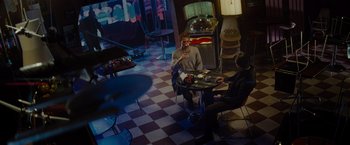 Movie still from “Star Trek” (2009), directed by J.J. Abrams – Two people are sitting at a table in a restaurant; Wide shot, High angle