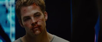 Movie still from “Star Trek” (2009), directed by J.J. Abrams – A young man with blood on his face; Close Up shot, Over the shoulder angle