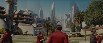 Movie still from “Star Trek” (2009), directed by J.J. Abrams – A group of people standing in front of a large city; Extreme Wide shot, High angle