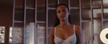 Movie still from “Star Trek” (2009), directed by J.J. Abrams – A woman in a white bra is posing for a picture; Close Up shot, Over the shoulder angle