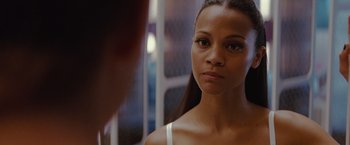 Movie still from “Star Trek” (2009), directed by J.J. Abrams – A beautiful young woman looking at the camera in front of a mirror; Close Up shot, Over the shoulder angle