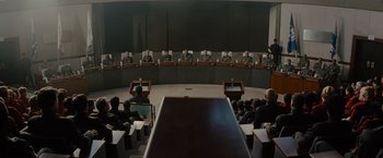 Movie still from “Star Trek” (2009), directed by J.J. Abrams – A group of people sitting in front of a large screen; Wide shot, High angle