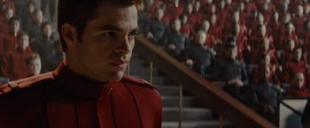 Movie still from “Star Trek” (2009), directed by J.J. Abrams – A man in a red jacket looking at the camera; Close Up shot, Over the shoulder angle