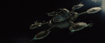 Movie still from “Star Trek” (2009), directed by J.J. Abrams – An image of a space station in the dark; Extreme Wide shot, Overhead angle