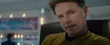 Movie still from “Star Trek” (2009), directed by J.J. Abrams – A person wearing a yellow shirt; Close Up shot, Over the shoulder angle