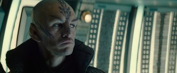 Movie still from “Star Trek” (2009), directed by J.J. Abrams – A person with a tattoo on his face; Close Up shot, Low angle