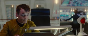 Movie still from “Star Trek” (2009), directed by J.J. Abrams – A young man sitting in front of a laptop computer; Close Up shot, Over the shoulder angle