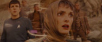 Movie still from “Star Trek” (2009), directed by J.J. Abrams – A woman with a head scarf looking surprised; Close Up shot, Low angle