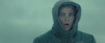 Movie still from “Star Trek” (2009), directed by J.J. Abrams – A man in a hooded jacket looking surprised; Close Up shot, Low angle