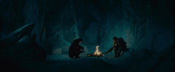 Movie still from “Star Trek” (2009), directed by J.J. Abrams – Two people sitting around a fire in the dark; Wide shot, High angle