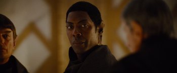 Movie still from “Star Trek” (2009), directed by J.J. Abrams – A person wearing a black jacket; Close Up shot, Over the shoulder angle