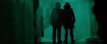 Movie still from “Star Trek” (2009), directed by J.J. Abrams – A couple of people standing next to each other in the dark; Wide shot, Low angle