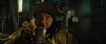 Movie still from “Star Trek” (2009), directed by J.J. Abrams – A man holding a metal cup in his hand; Close Up shot, Over the shoulder angle