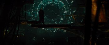Movie still from “Star Trek” (2009), directed by J.J. Abrams – A man standing in front of a large clock; Wide shot, Low angle