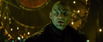 Movie still from “Star Trek” (2009), directed by J.J. Abrams – A man with a face tattoo is looking at the camera; Close Up shot, Low angle