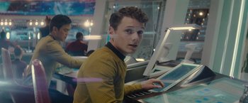Movie still from “Star Trek” (2009), directed by J.J. Abrams – A man sitting in front of a computer in a room; Close Up shot, Over the shoulder angle