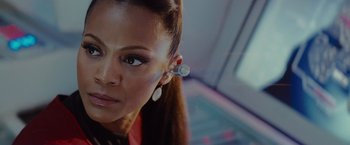 Movie still from “Star Trek” (2009), directed by J.J. Abrams – A person wearing a ear piece; Close Up shot, Over the shoulder angle