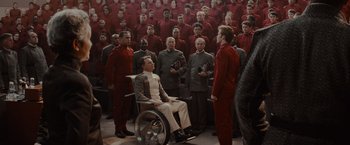 Movie still from “Star Trek” (2009), directed by J.J. Abrams – A group of people in red suits standing around a man in a wheel chair; Wide shot, High angle
