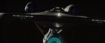 Movie still from “Star Trek” (2009), directed by J.J. Abrams – A star trek ship in space; Extreme Wide shot, Overhead angle