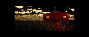 Movie still from “Star Trek Beyond” (2016), directed by Justin Lin – A red fire hydrant sitting in the middle of a field; Extreme Close Up shot, Overhead angle