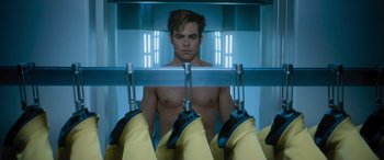 Movie still from “Star Trek Beyond” (2016), directed by Justin Lin – A man standing in front of a mirror in a room; Medium shot, Low angle