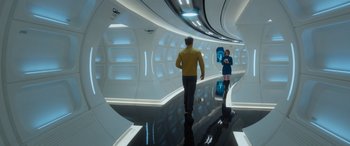 Movie still from “Star Trek Beyond” (2016), directed by Justin Lin – A man and a woman are standing in a room; Wide shot, Over the shoulder angle