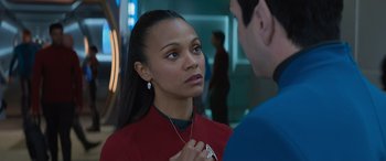 Movie still from “Star Trek Beyond” (2016), directed by Justin Lin – A woman in a red shirt and a man in a blue shirt; Close Up shot, Over the shoulder angle