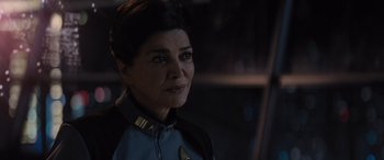 Movie still from “Star Trek Beyond” (2016), directed by Justin Lin – A person wearing a star trek uniform; Close Up shot, Over the shoulder angle