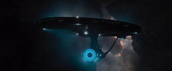Movie still from “Star Trek Beyond” (2016), directed by Justin Lin – A view of a ship from below with a light on it; Extreme Wide shot, Overhead angle